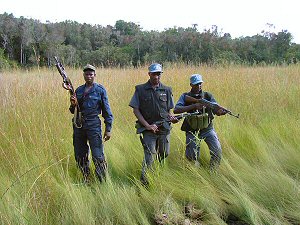 Three trainee guards on a security field exercise on the Guard Force Training course